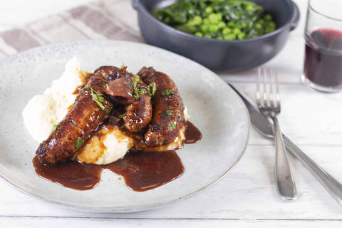 red wine sauce with sausages and mash